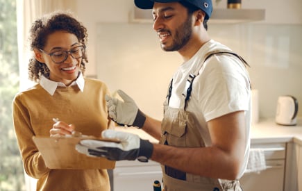 Woman at home looking at her home energy audit report