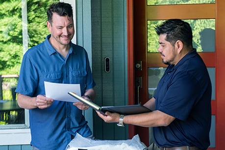 Two men going over notes